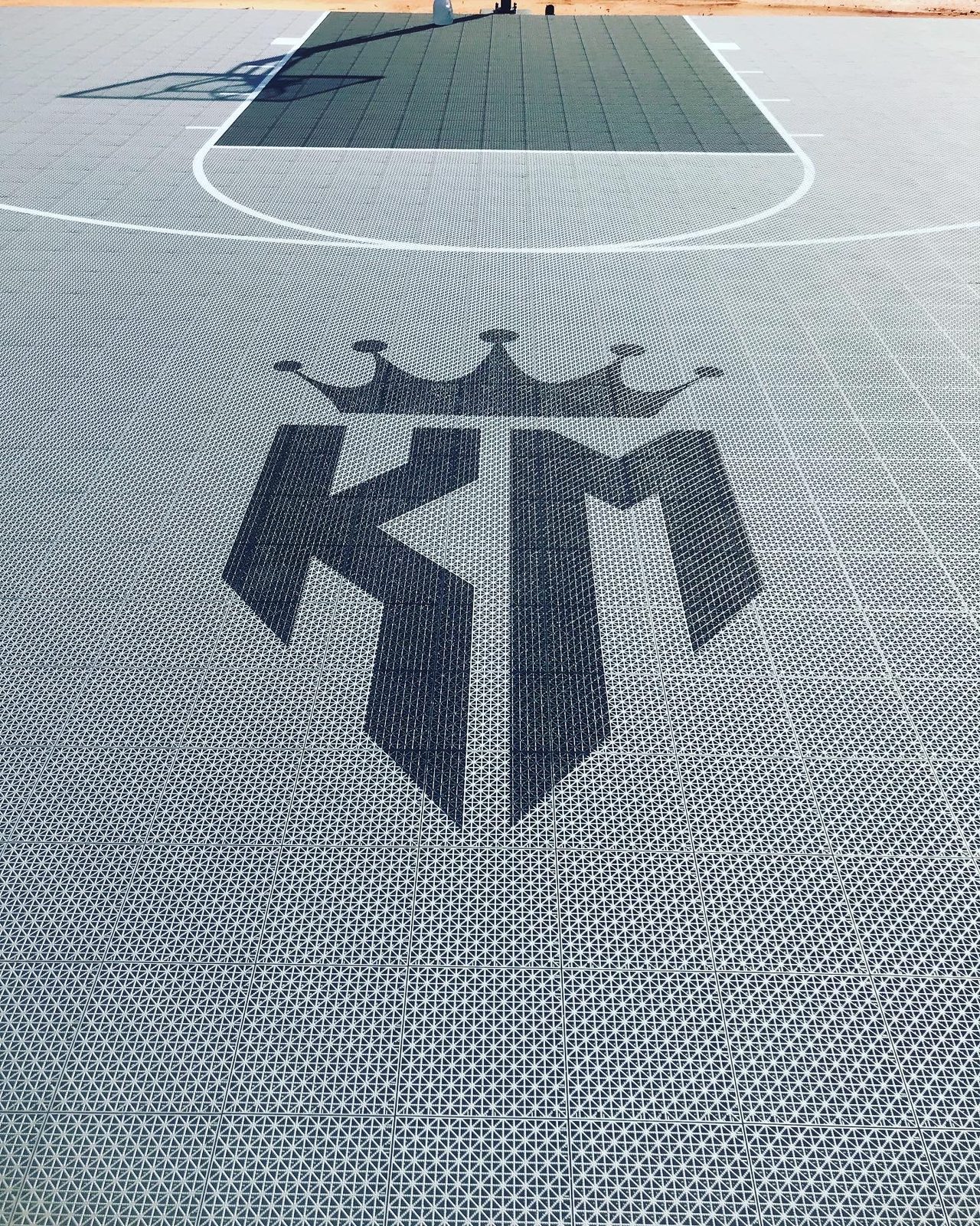 Custom logo inlaid in a VersaCourt sport court